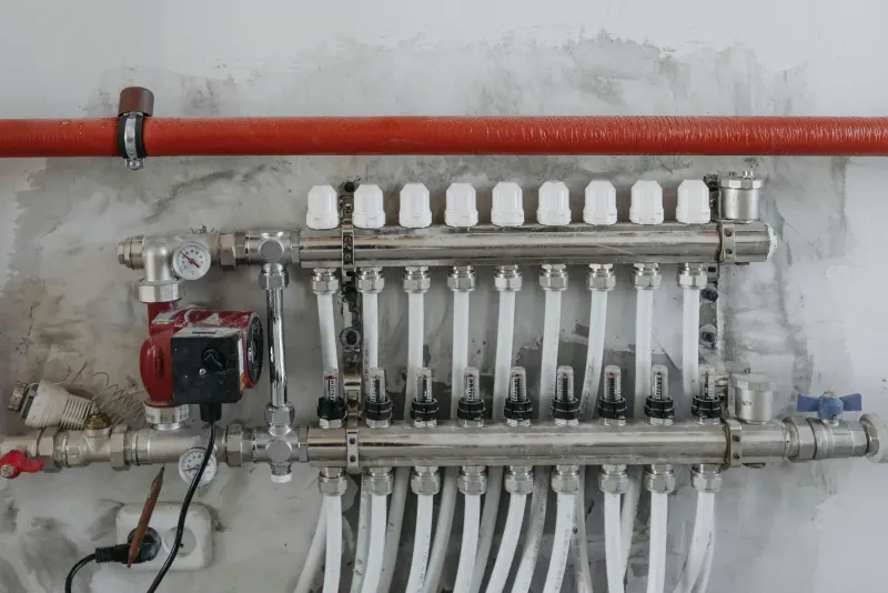 Water distribution manifold and connected piping