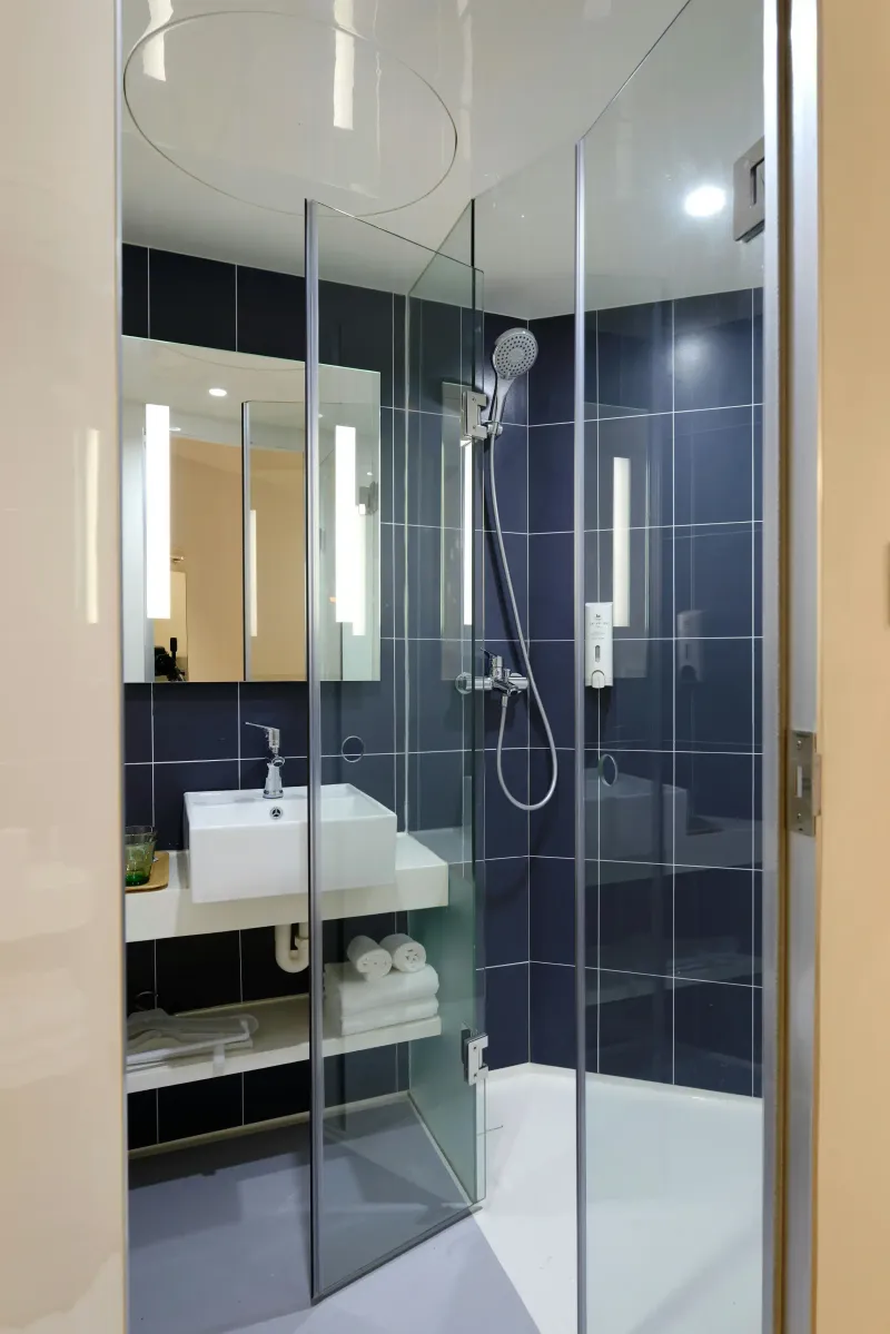 Shower enclosure and bathroom fixtures