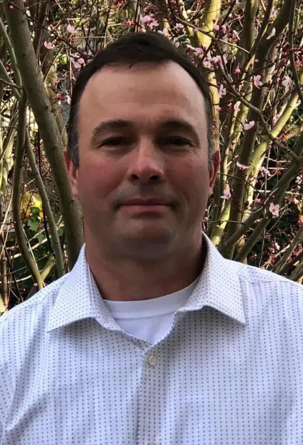 Photo of a plumber detecting a leak