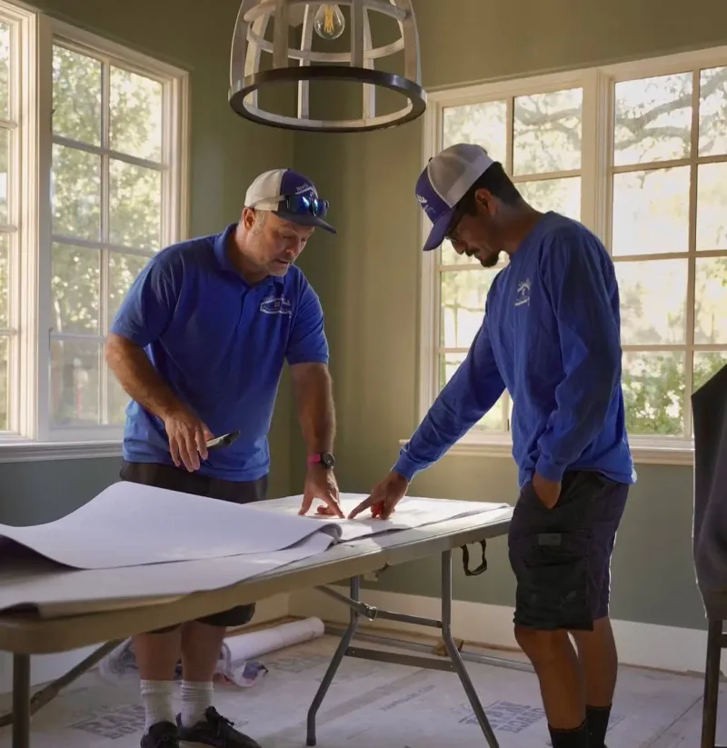 North Bay Platinum Plumbing team reviewing building plans